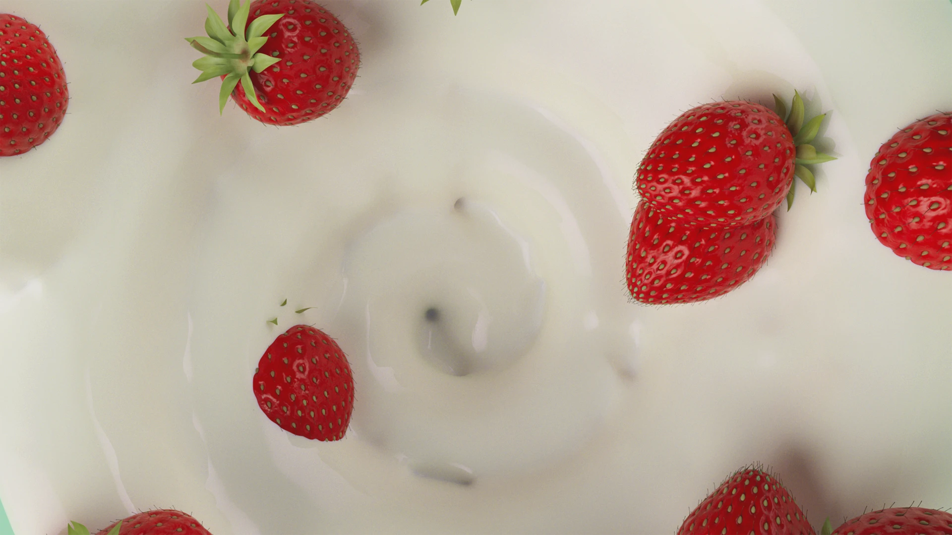 Strawberries dropping into a swirl of yogurt, seen from above